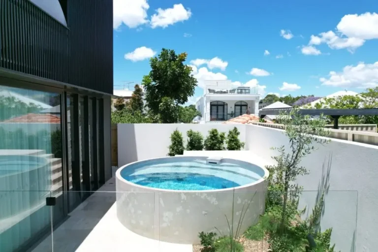 Elegant above ground plunge pools with glass fencing