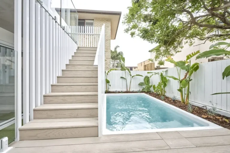 Inground plunge pool with a nearby outdoor staircase