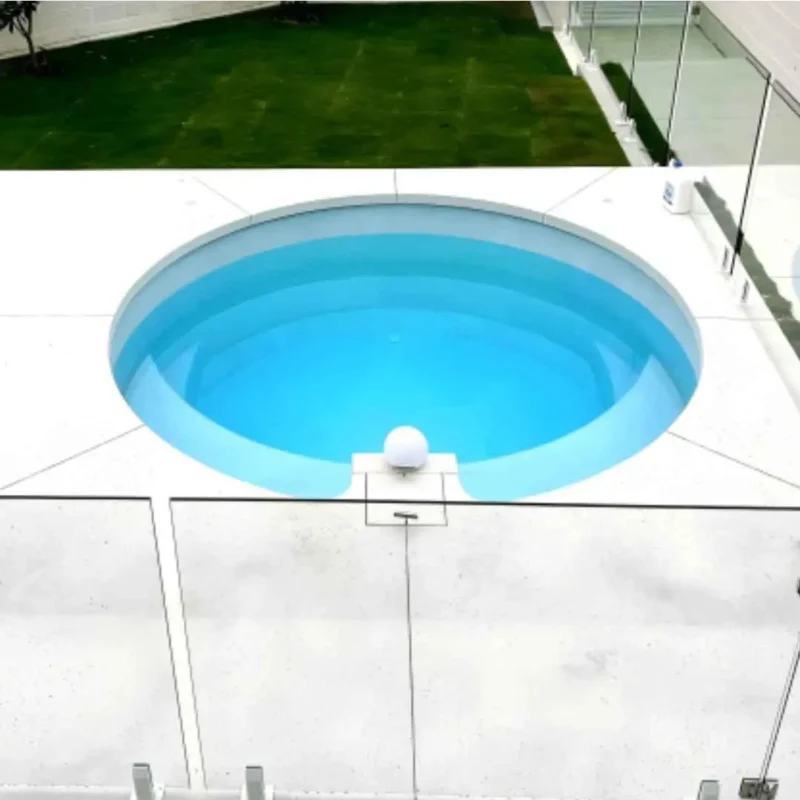 Small round plunge pool with clean concrete surround in Robina Gold Coast