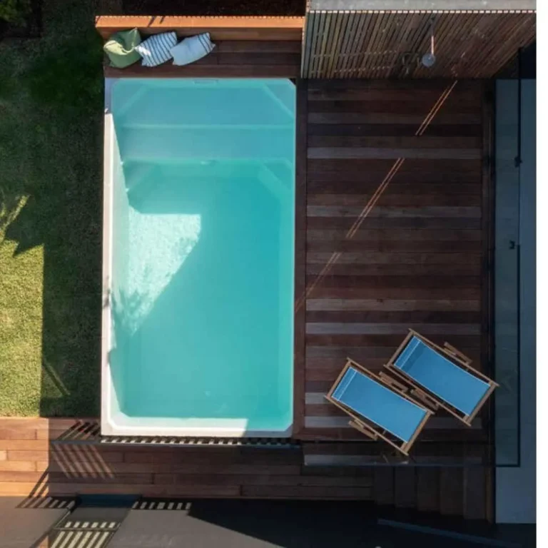 Rectangular precast plunge pool with timber deck and lounge chairs in Broadbeach Gold Coast