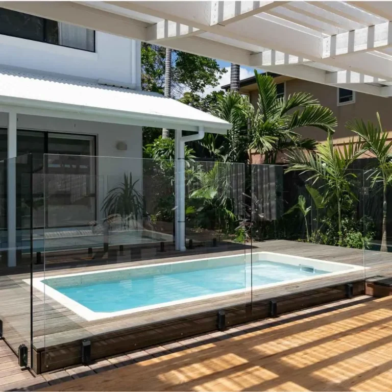 Modern inground plunge pool with glass fencing and timber deck in Burleigh Gold Coast